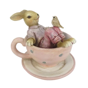 Csészében fekvő nyuszi térdén madárkával 10 x 8 x 8 cm Csészében fekvő nyuszi térdén madárkával 10 x 8 x 8 cm